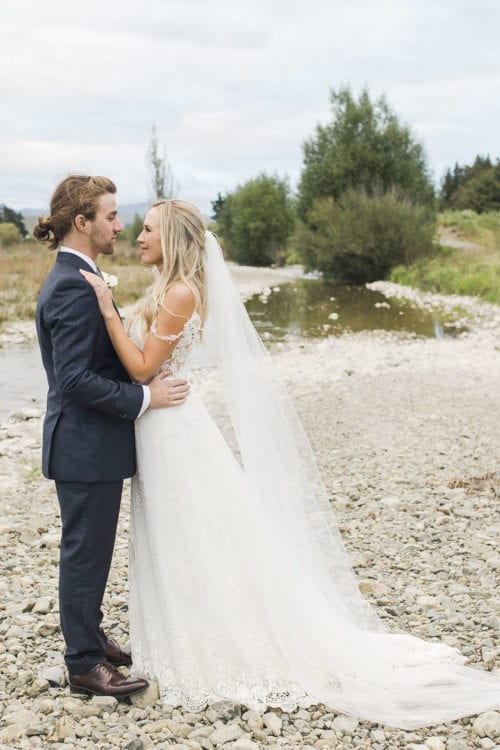 Real Weddings | Vinka Design | Real Brides Wearing Vinka Gowns | Olivia and Brayden face to face onriver bed