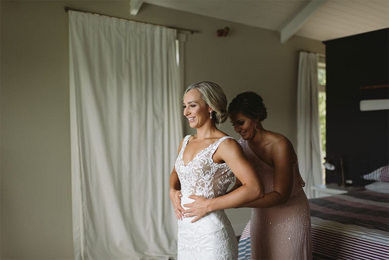 Testimonials | Vinka Design | Real Bridal Reviews from Our Clients | Nikki being fitted into bespoke wedding dress