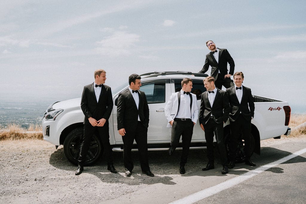 Vinka Design Features Real Weddings - groom and groomsmen with wedding car