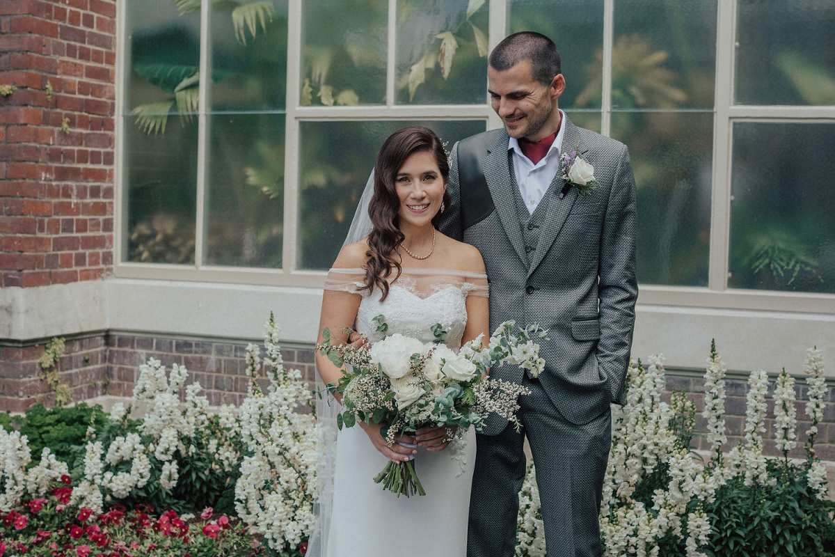 Vinka Design Features Real Weddings - bride in custom made gown. Bride and groom arm in arm