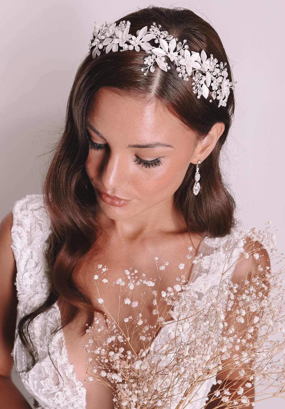 Vinka Design Bridal Accessories - Bridal headpiece - available from Vinka Design Auckland bridal store. Stunning drop earrings worn with flower headpiecce headband