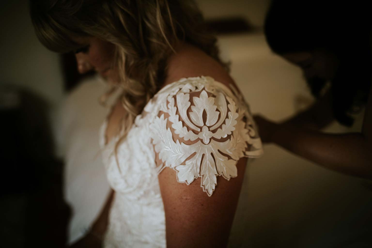 Vinka Design Features Real Weddings - bride wearing bespoke Vinka wedding gown - lace detail on shoulder