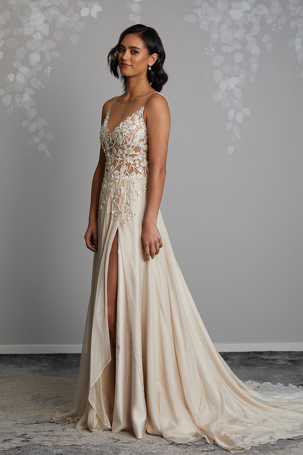 Champagne Silk wedding gown. Semi sheer bodice with beaded botanical lace, dainty pearls & sequins. Flowing chiffon skirt with front split, V-neck, low V-back and short train. Vinka Design Auckland, NZ