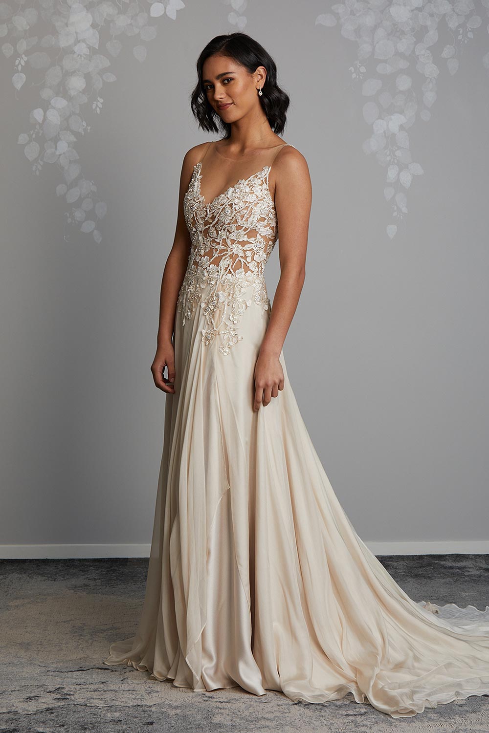 Champagne Silk designer wedding gown. Semi sheer bodice with beaded botanical lace, dainty pearls & sequins. Flowing chiffon skirt with front split, V-neck, low V-back and short train. Vinka Design Auckland, NZ